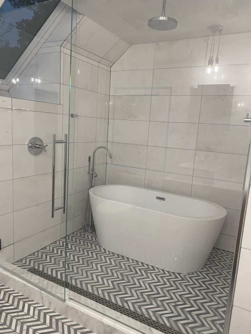 A bathroom with a tub and shower in it